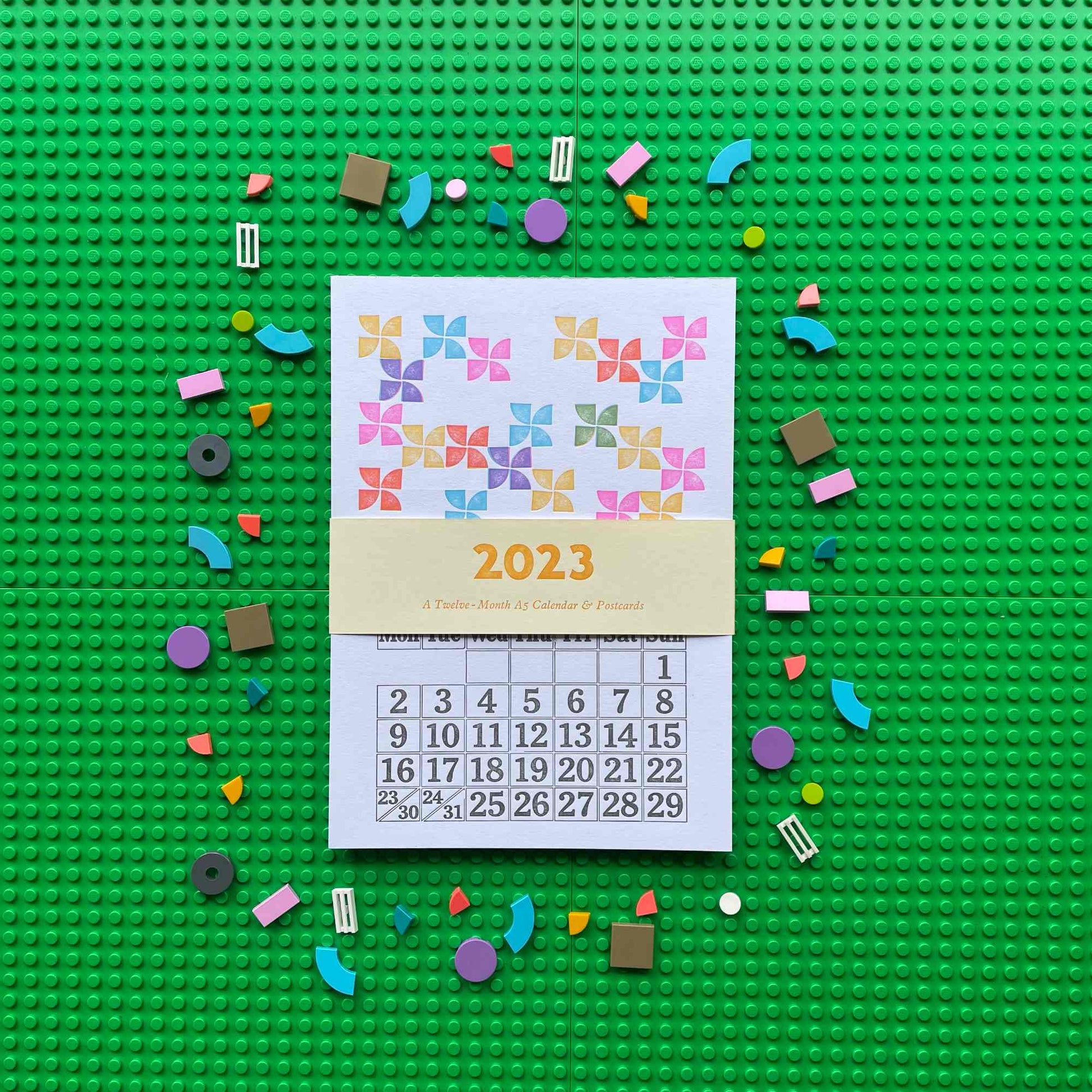 Calendar for 2023 on a green baseplate with colorful building blocks