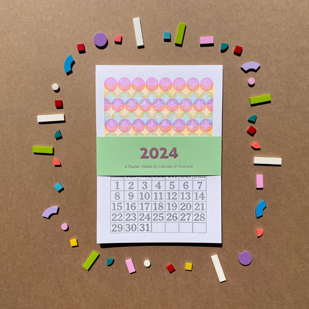 2024 calendar with colorful geometric shapes on a brown background