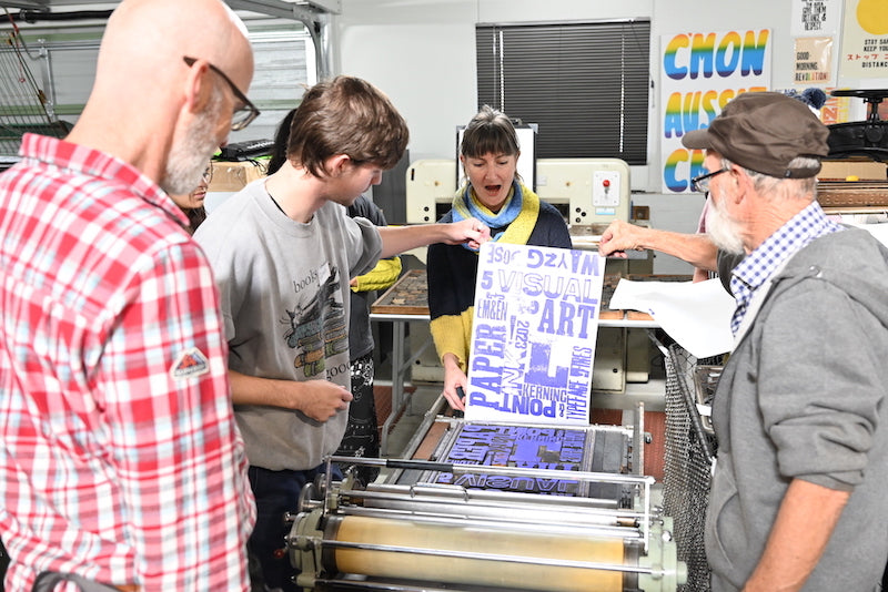 Freshly printed poster in a wood type poster printing workshop with Phil Gambrill in Wayzgoose 2023