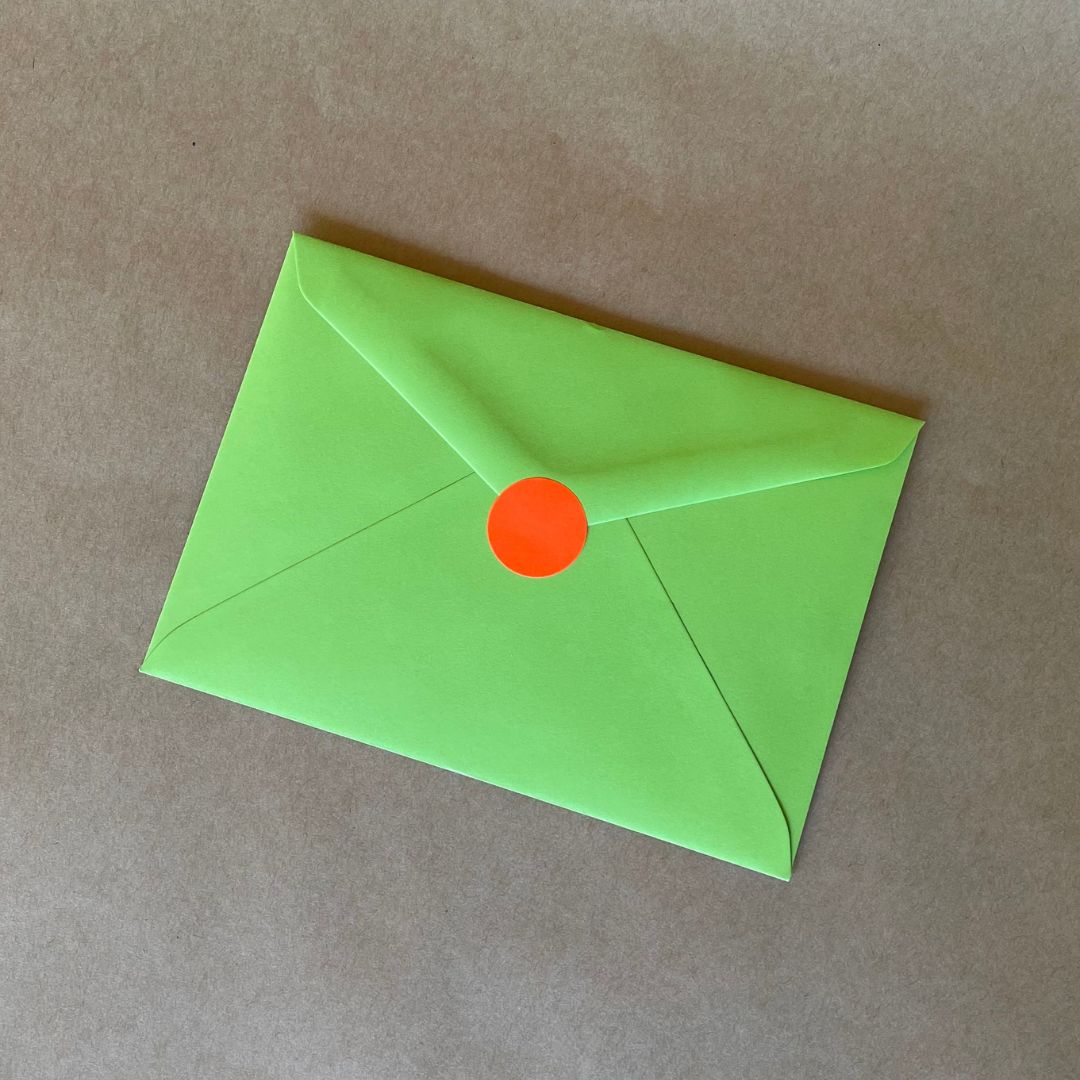 Wishing You A Bright Christmas Card's envelope with the fluoro red circle sticker