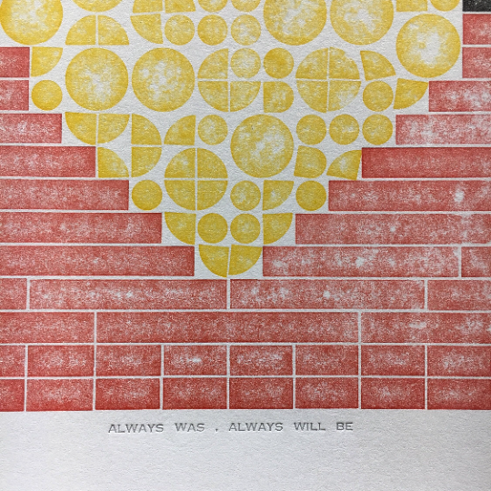 Close up of text reading "Always Was, Always Will Be" below the lego tile printed design