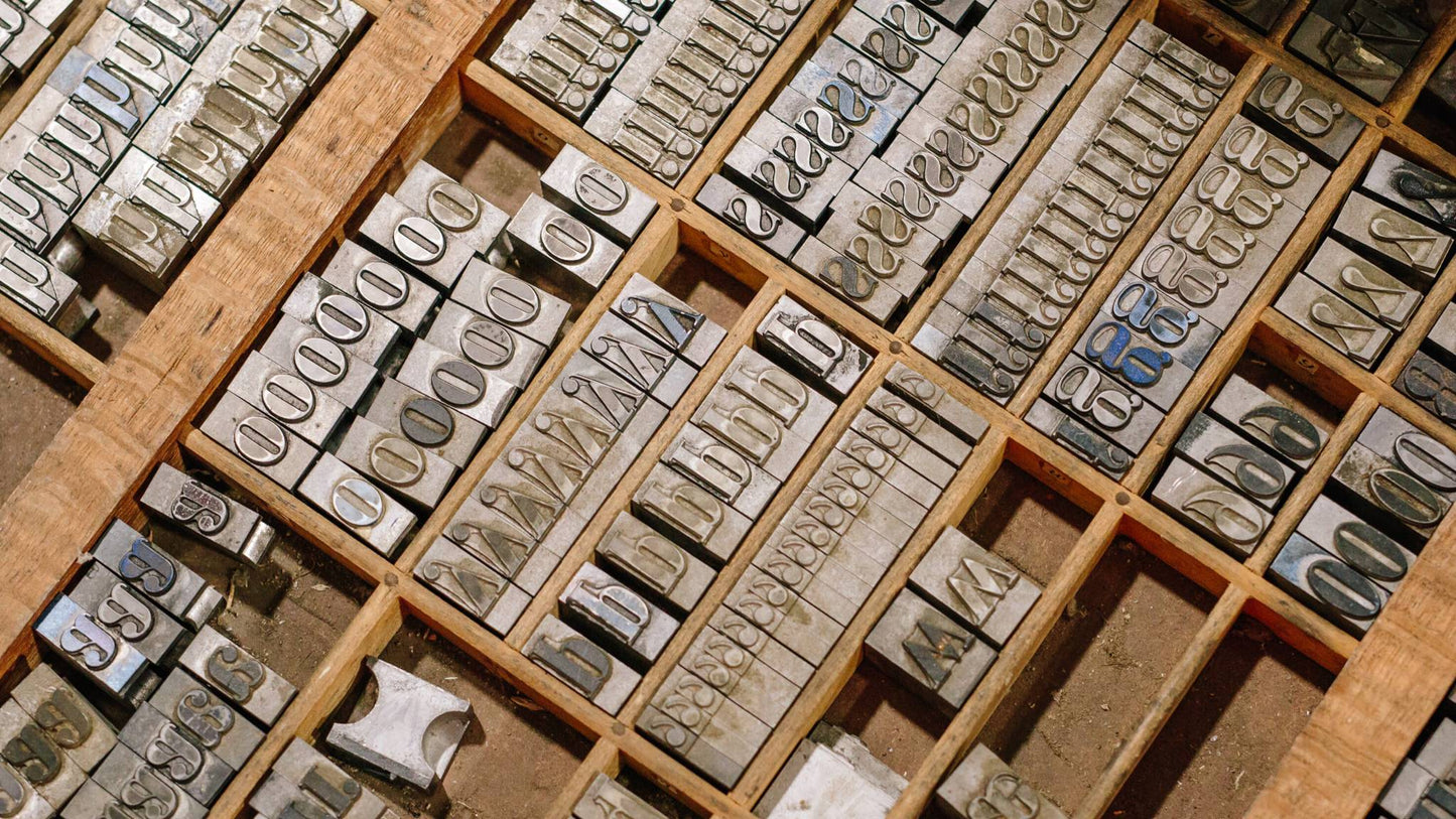 A bird's eye view of a type case full of Bodoni typeface.