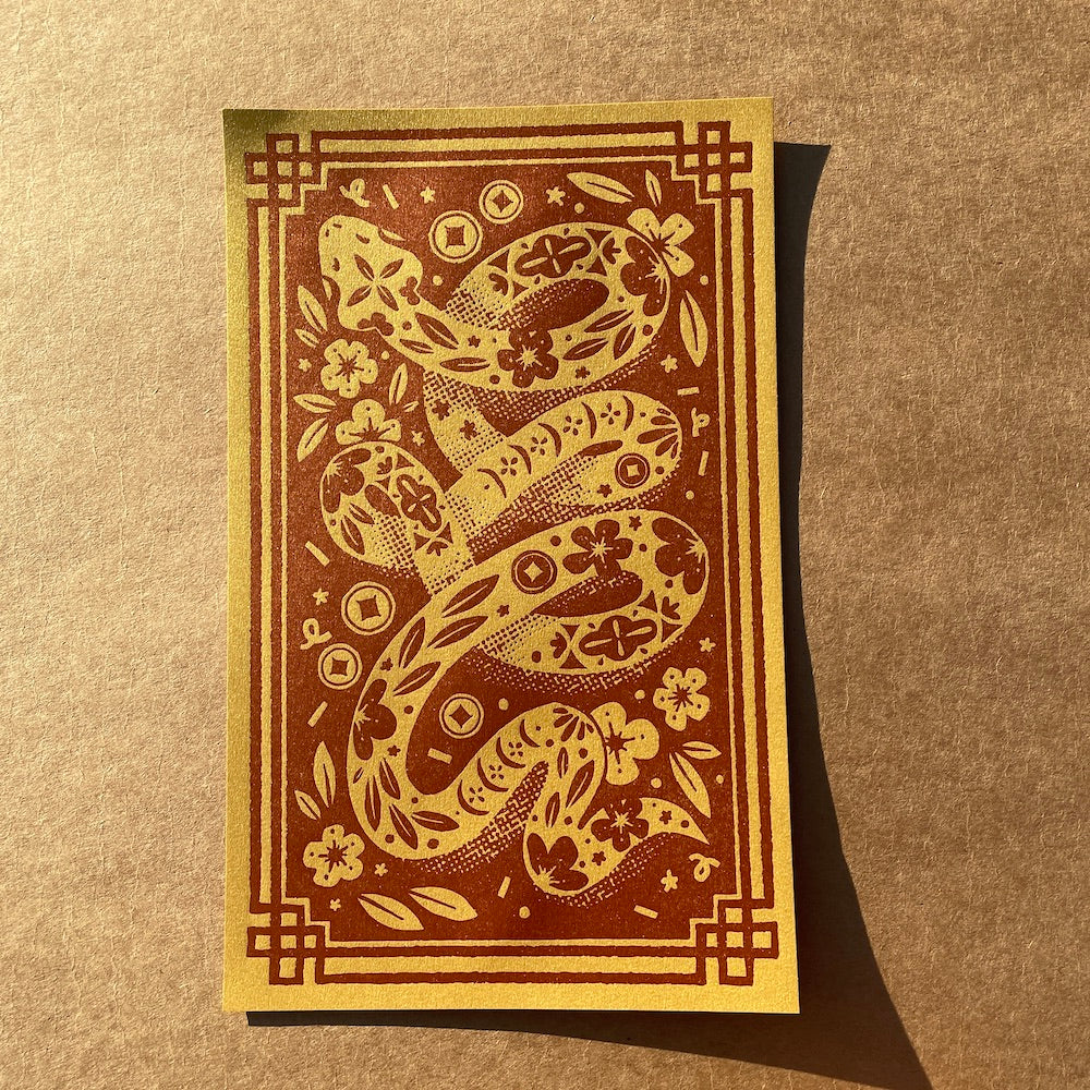 Decorative print with a snake design on a brown background