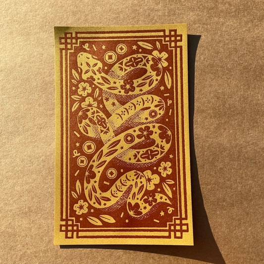 Decorative print with a snake design on a brown background