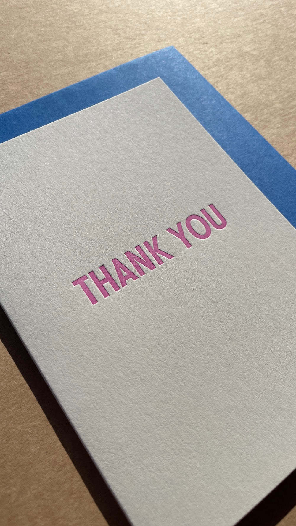 Close up of the card. You can see the letterpress impression around the text.