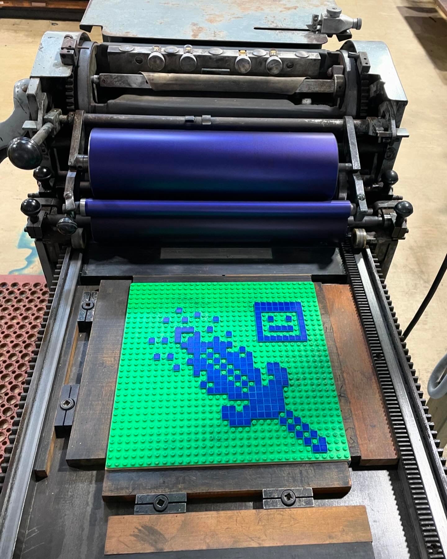 Bird's eye view of a minecraft inspired design created with lego tiles on the printing press